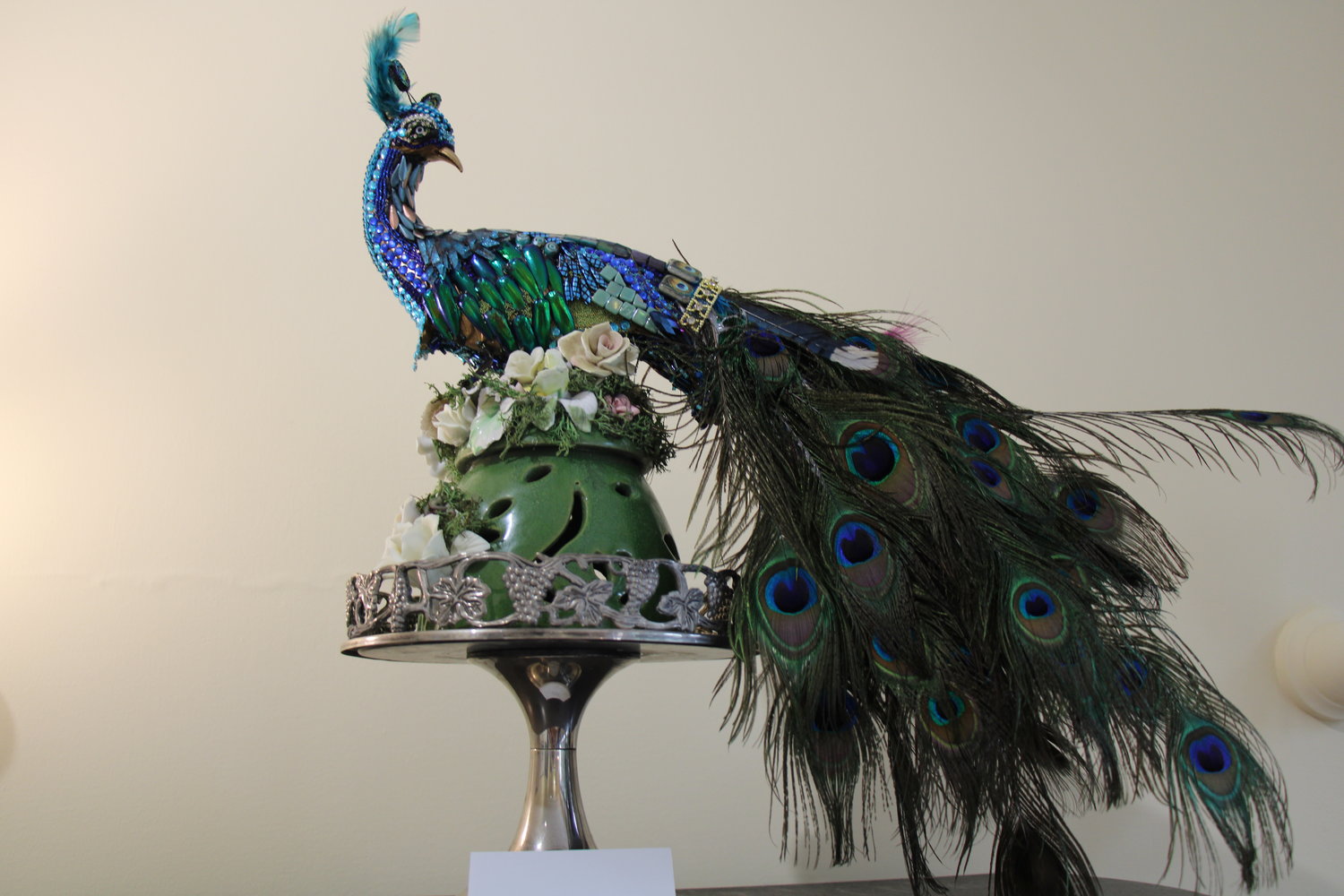 Captured for its beauty, the jeweled peacock is both a relic of the Gilded Age, but emblematic of individual modernity. 
“Inspiration Indigo” Eileen W. Palmer
Mixed media beaded sculpture.
